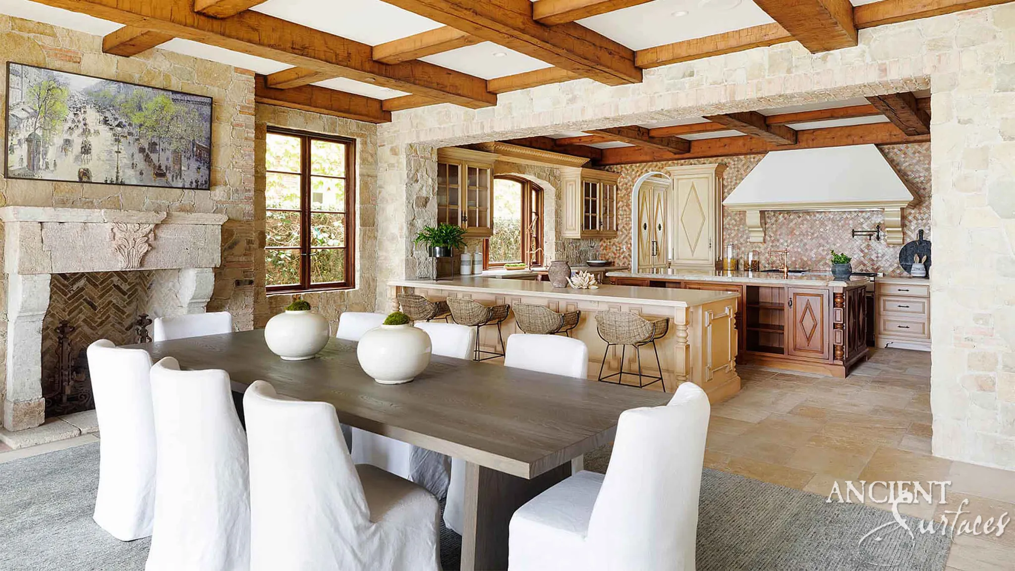 Primitive reclaimed limestone fireplace mantel with a single carved corbel in a Tuscan farmhouse