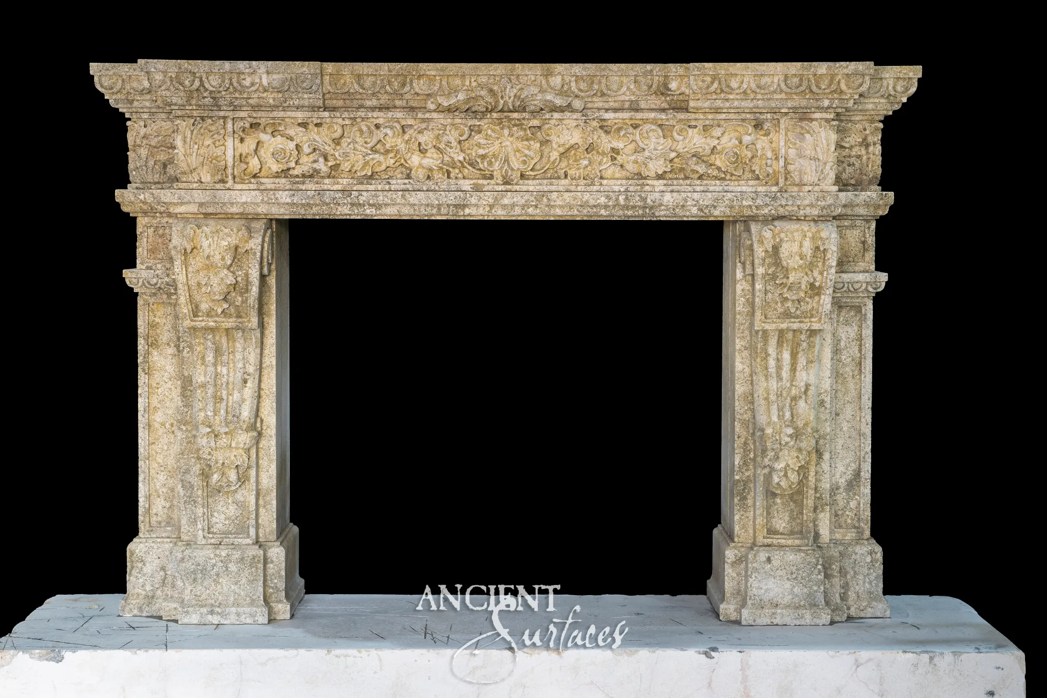 Heavily weathered antique limestone fireplace mantel with golden lichen patina and foliate frieze